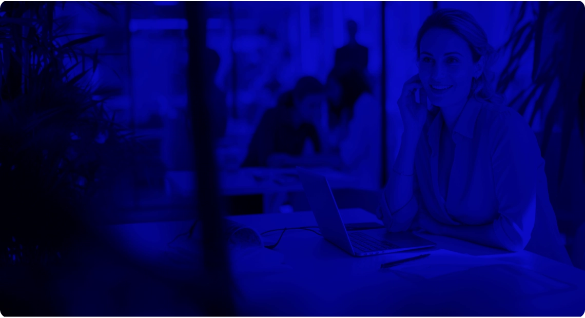 Smiling lady working with a laptop